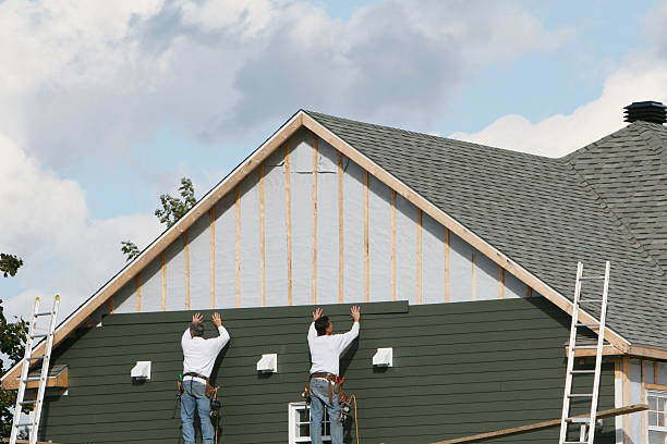 Professional Siding Contractor technician working in Aurora, IN